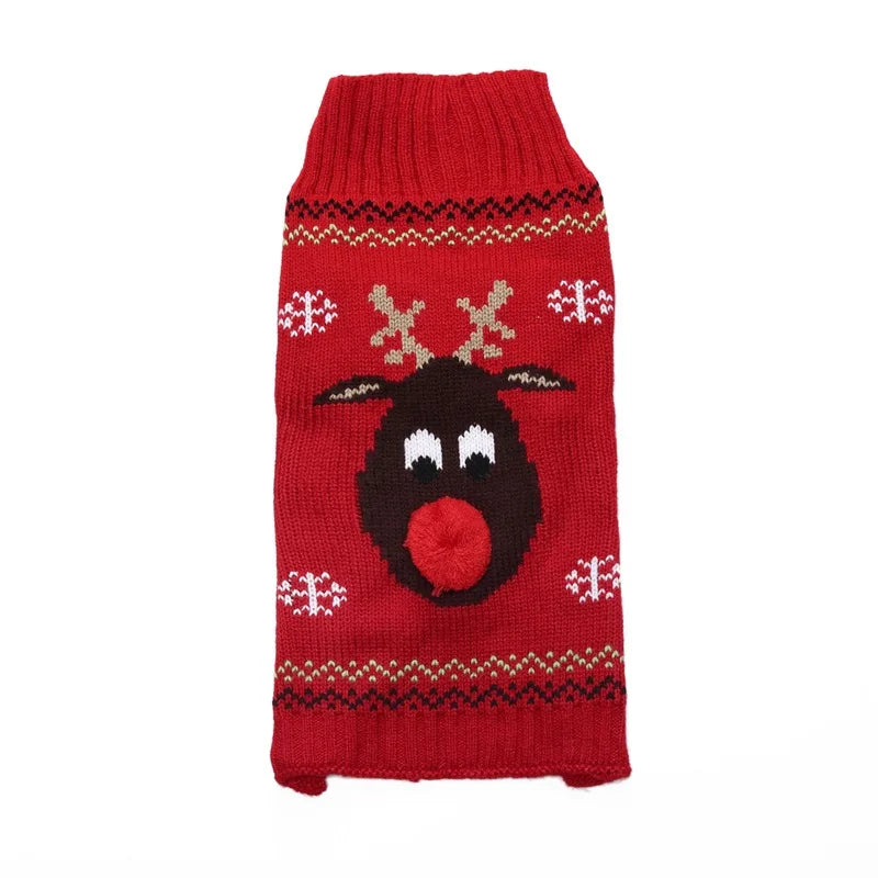 Pull de Noël rouge pour chien posé à plat : tête de renne, flocons blancs et nez pompon rouge